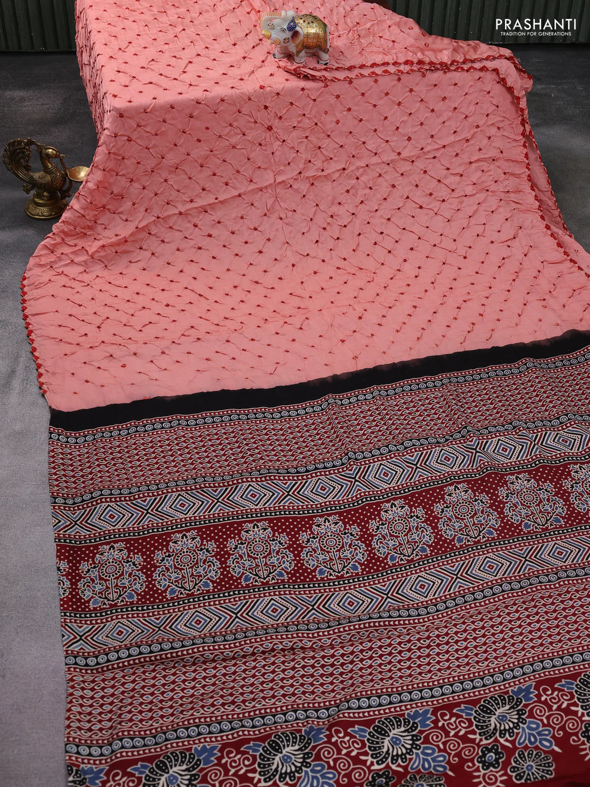 Modal silk saree peach orange and maroon with allover bandhani butta prints and ajrakh printed pallu & Blouse