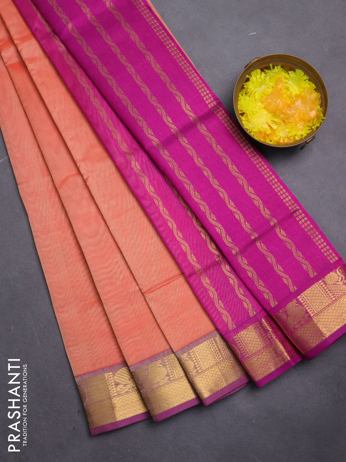 Silk cotton saree peach orange and purple with plain body and zari woven border