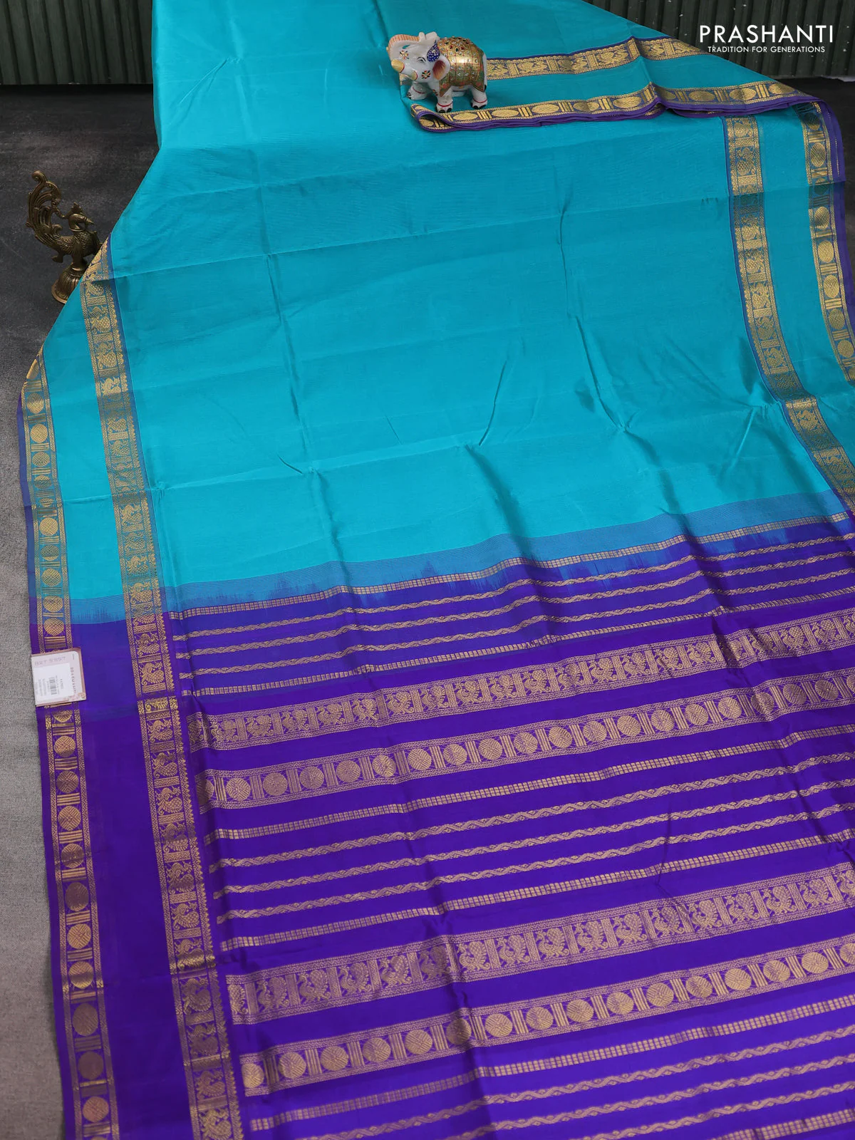 Silk cotton saree teal blue and violet with plain body and rettapet zari woven border - Image 2